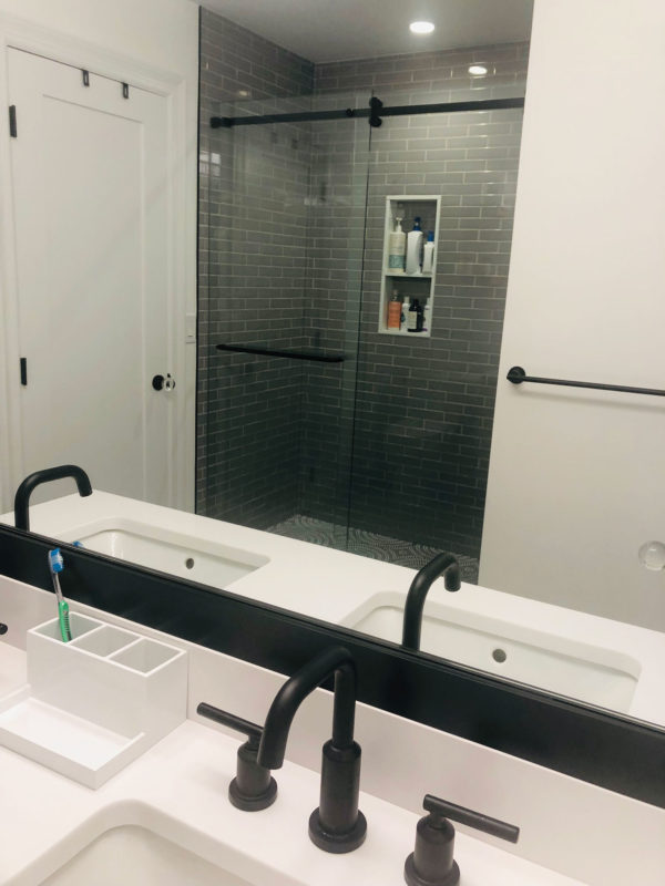 Shower Stall with Gray Gloss Subway and Glass Mosaic Floor Tile. White Quartz Countertop
