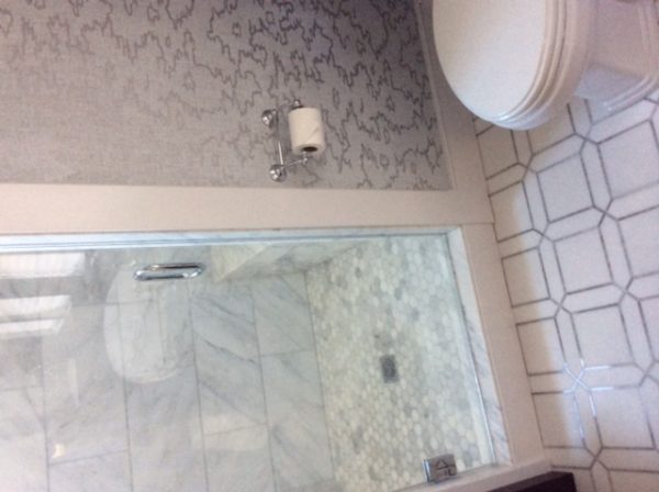 Asian Cararra Marble Shower with Large Hexagon Floor Tile