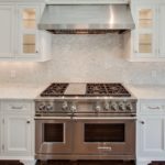 white-cararra-countertops-with-white-cararra-mosaic- backsplash